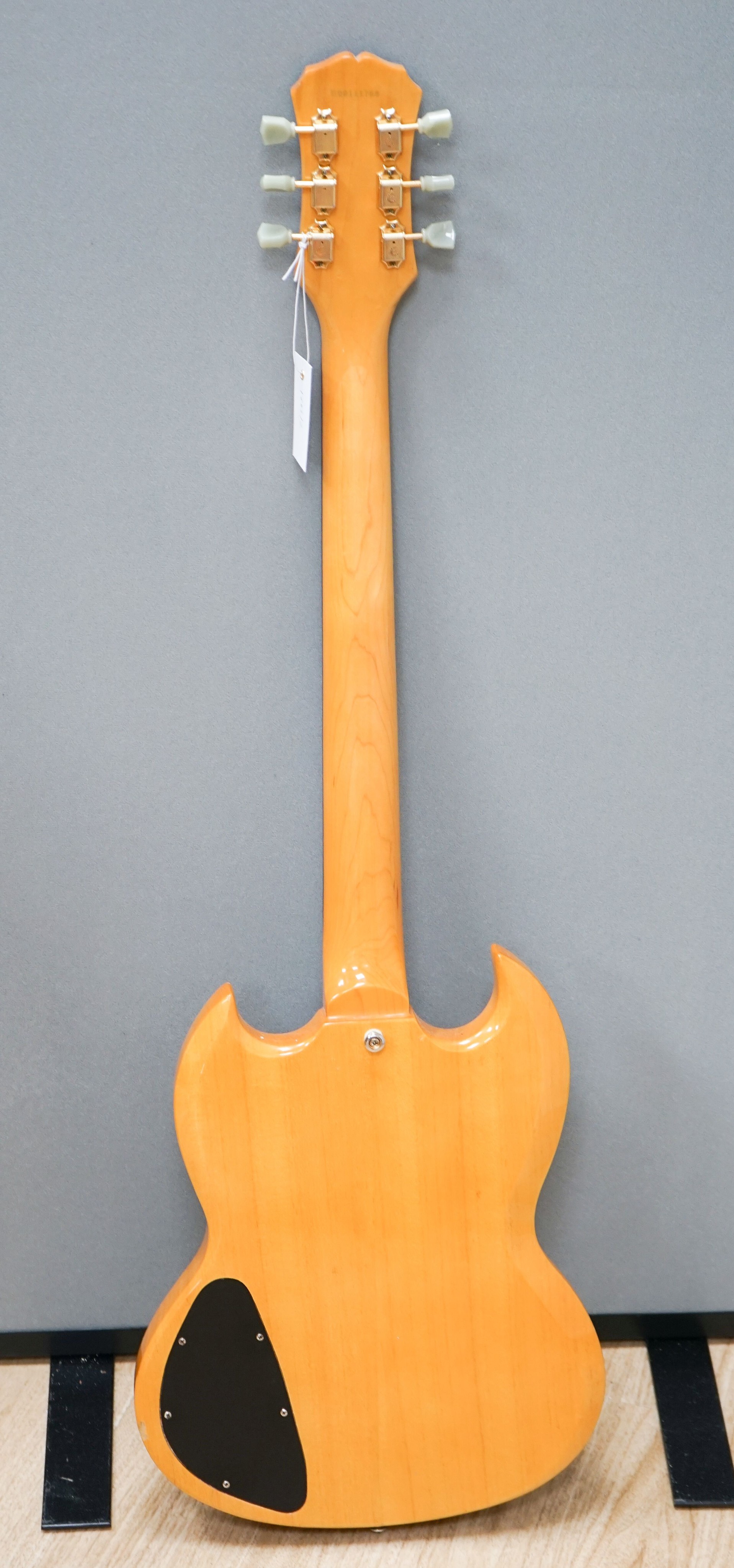 An Epiphone SG guitar, serial no. UOO111768